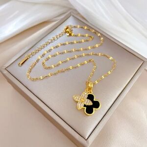 Elegant Gold and Black Stainless Steel Pendant Necklace.